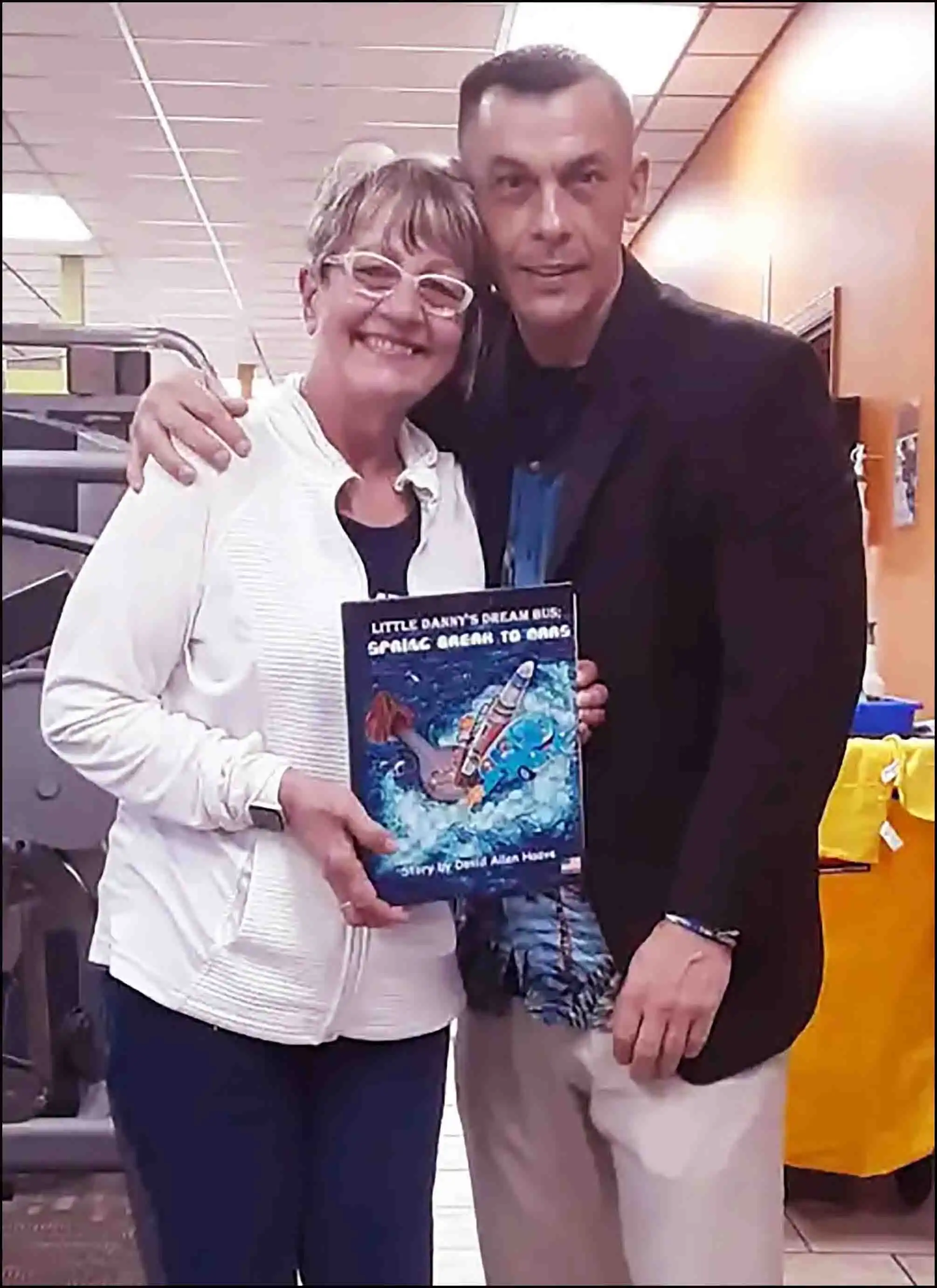 Author David Haave signs his new book for the Texas Children's Hospita -- David Haave